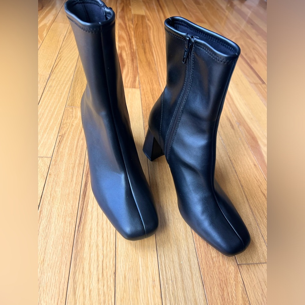 Black tall ankle boots